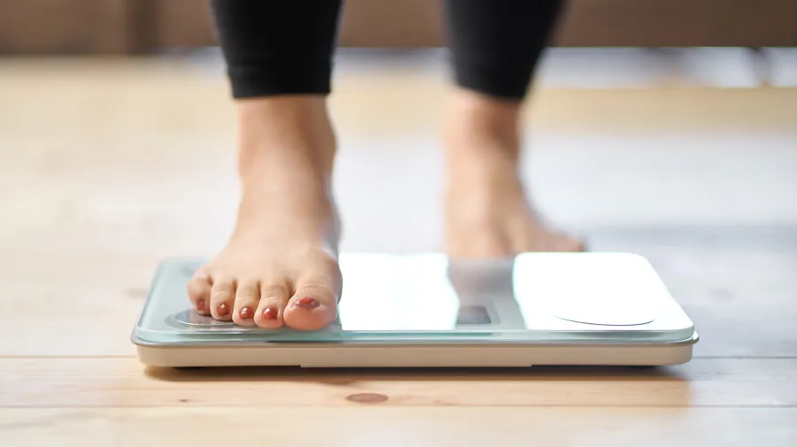Lady standing on scales